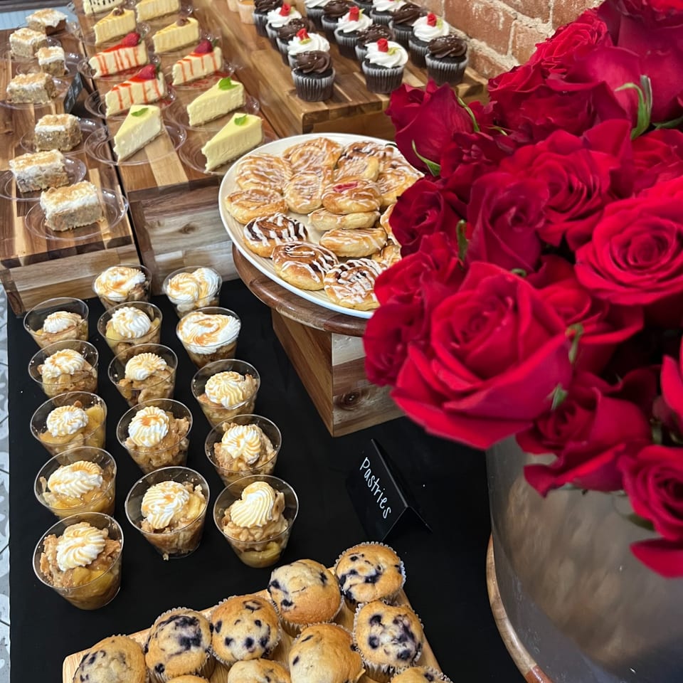 Dessert display with cupcakes, cheesecake, pastries and muffins